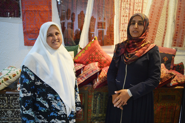 Iman Imarat (right) and Najla Hussain pose for a photo at the Jordan Craft Centre Al Aydi in Amman recently (Photo by By Ana V. Ibáñez)