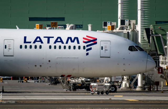 In this file photo taken on May 26, 2020, a Latam Airlines plane sits on the tarmac at Santiago International Airport, in Santiago  (AFP Photo)
