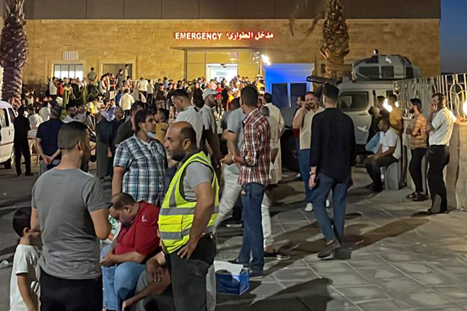 People gather outside a hospital following a toxic gas explosion in Jordan's Aqaba Port, on Monday (AFP photo)