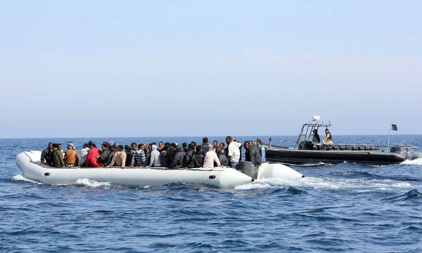 Libyan coast guards escort a boat carrying illegal migrants, who had hoped to set off to Europe with the help of people smugglers from the coastal town of Garabulli, towards the Libyan navy to the capital, Tripoli, prior to their arrest on Saturday Libya has a coastline of 1,770 kilometres. It is just 300 kilometres from the Italian island of Lampedusa, which many migrants fleeing poverty and conflict aim for as their gateway to Europe (AFP photo)