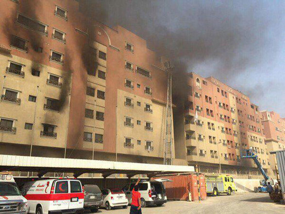 In this image released by the Saudi interior ministry’s general directorate of civil defence, smoke billows from a residential complex in Khobar, Saudi Arabia, on Sunday (AP photo)