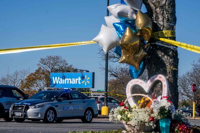 A memorial is seen at the site of a fatal shooting in a Walmart on Wednesday in Chesapeake, Virginia. Following the Tuesday night shooting, six people were killed, including the suspected gunman (AFP photo)