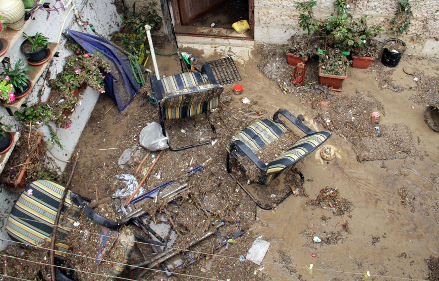 Garden furniture damaged by last Thursday’s deluge in the courtyard of a house in Amman (Photo by Osama Aqarbeh)