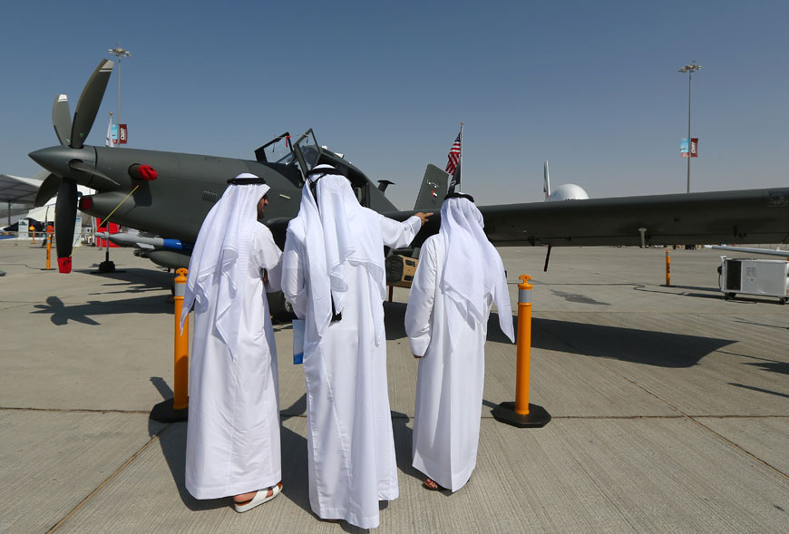 Men look at an US-made Archangel intelligence, surveillance and reconnaissance plane dislayed at the Dubai Airshow on Monday, in the Gulf Emirate (AFP photo)