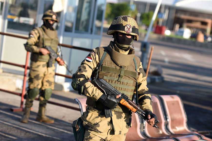 Egyptian special forces man a temporary checkpoint outside Sharm El Sheikh airport where the doomed Russian plane took off before crashing last month, as President Abdel Fattah Al Sisi visits on Wednesday (AFP photo)