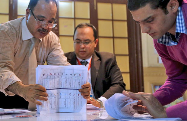 Officials count ballots after polls closed during the second round of parliamentary elections in Cairo, on Monday (Reuters photo)