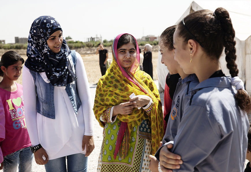 A handout picture released by the Malala Fund on July 12, shows education activist and Nobel Peace Prize laureate Malala Yousafzai (centre) talking with Syrian refugee girls as she opens a new school on her 18th birthday in Lebanon's Bekaa Valley funded by the Malala Fund, the non-profit organisation she co-founded with her father Ziauddin  (AFP photo/Malin Fezehai/Ho/Malala Fund)