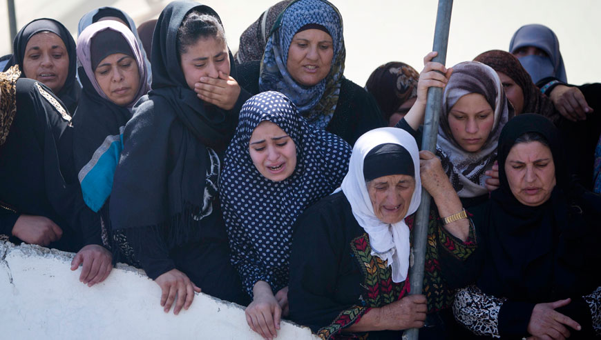 Palestinian women mourn during the funeral of Falah Abu Maria in the village of Beit Ummar near the West Bank city of Hebron on Thursday (AP photo)