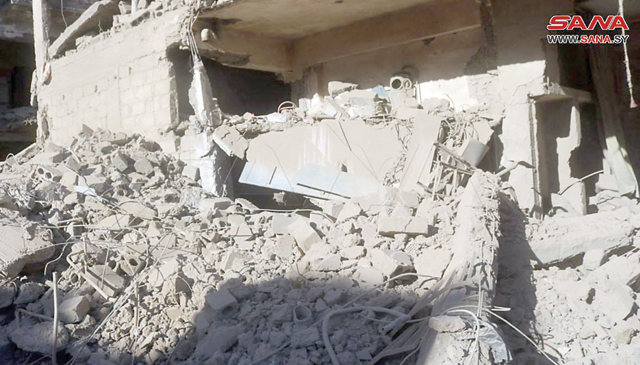 This handout photo taken and released on Wednesday by the official Syrian Arab News Agency (SANA), shows destruction following a drone strike whicin the government-held eastern city of Deir Ezzor, in an area controlled by Iran-backed factions, a war monitor said (AFP photo/HO/SANA)