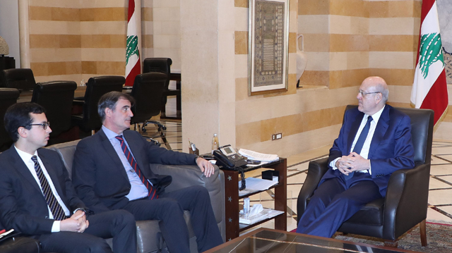 A handout photo provided by the Lebanese photo agency Dalati and Nohra on Thursday shows Lebanese caretaker prime minister Najib Mikati meeting with a delegation from the Ineternational Monetary Fund (IMF) at the governmental palace in Beirut, on Thursday (AFP photo)