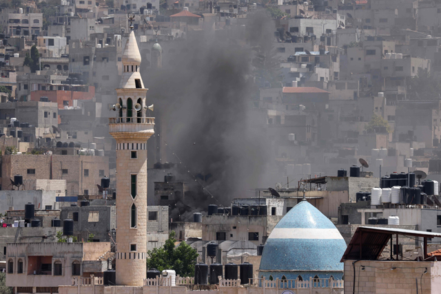 Smoke billows during an Israeli military operation in Jenin city in the occupied West Bank on Monday (AFP photo)