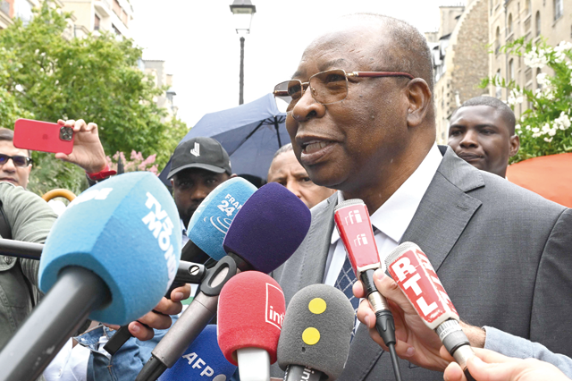 Niger Prime Minister Ouhoumoudou Mahamadou speaks to the press outside the Niger Embassy, in Paris, on Saturday, days after coup plotters ousted Niger's president, holding him with his family in his official Niamey residence since July 26 (AFP photo)