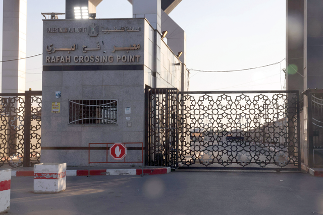 A photo taken on Tuesday shows the closed gates of the Rafah border crossing with Egypt. Gaza's border crossing with Egypt, its only one that bypasses Israel, was hit by an Israeli air strike on Tuesday for the second time in 24 hours, witnesses and a rights group said.  (AFP photo)