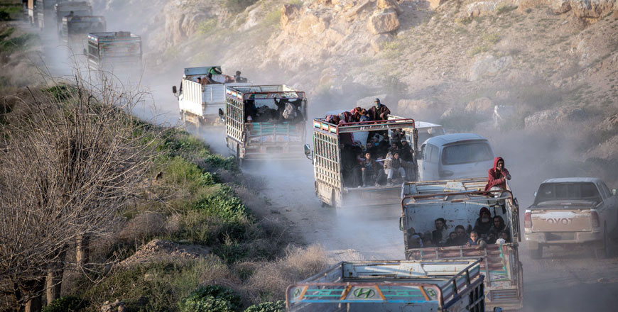   People who fled the Daesh group's last holdout of Baghouz, in Syria's northern Deir Ezzor province, ride in the back of trucks in an area controlled by the Kurdish-led Syrian Democratic Foces on Monday (AFP photo)