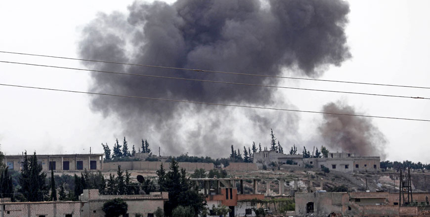 Smoke billows following Syrian government forces' bombardment around the town of Al Habit on the southern edges of the rebel-held Idlib province on Sunday (AFP photo)