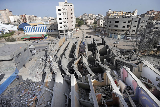 This photo taken on Monday shows a building in Gaza City that was destroyed during Israeli air strikes on Gaza City (AFP photo)