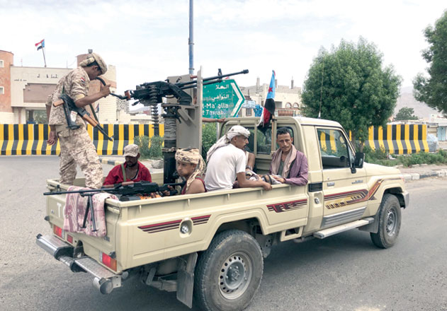 Fighters of the UAE-trained Security Belt force, dominated by members of the Southern Transitional Council which seeks independence for south Yemen, patrol a street in an area near the Aden International airport on Wednesday (AFP photo)