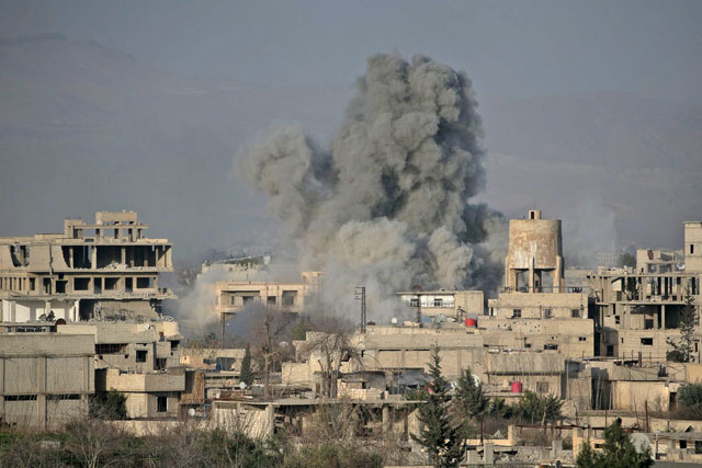 Smoke billows following Syrian government bombardments on the besieged rebel-held town of Hammouria in the eastern Ghouta region on the outskirts of the capital Damascus on Saturday (AFP photo)