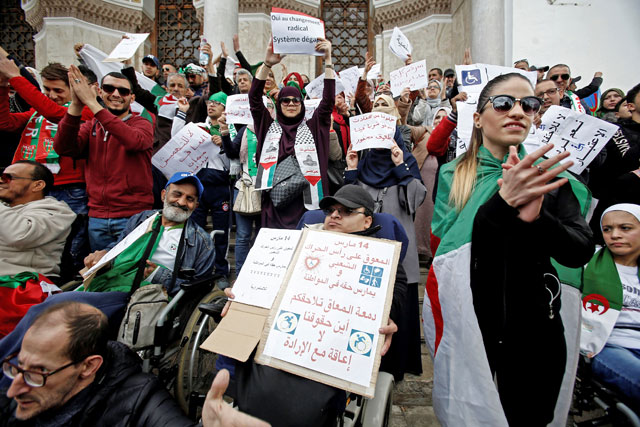   People with special needs, accompanied by their families, take part in a protest demanding immediate political change and improvement of their living conditions in Algiers, Algeria, on Thursday (Reuters photo)
