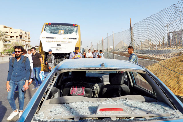A damaged bus is seen at the site of a blast near a new museum being built close to the Giza pyramids in Cairo, Egypt, on Sunday  (Reuters photo)