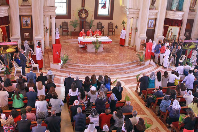 Christians perform rituals on Palm Sunday in Amman last week   (Photo by Hassan Tamimi)