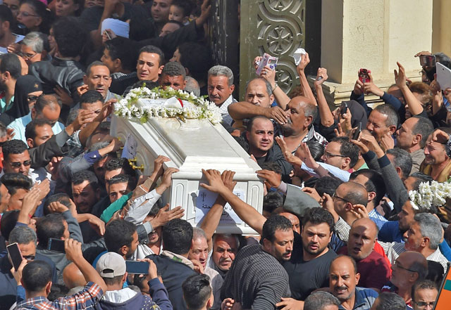 Coptic Christians carry the coffins of victims killed in an attack a day earlier, following a morning ceremony at the Prince Tadros Church in Egypt’s southern Minya province, onSaturday (AFP photo)