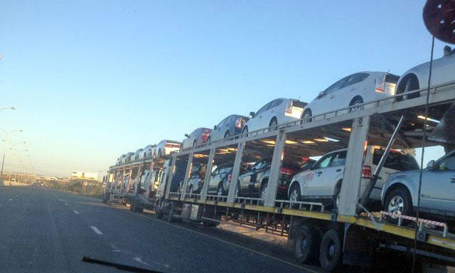 Imported cars are being transported to free zones for sale in this undated photo (JT file photo)