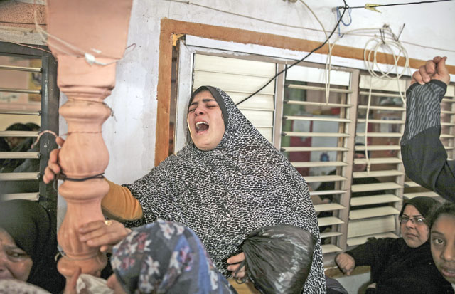 A woman mourns during the funeral ceremony of 20-year-old Jamal Muslih, who was wounded, and later lost his life, in the confrontations between Palestinian protesters and Israeli forces during a demonstration against US President Donald Trump’s recognition of Jerusalem as Israel’s capital, at Al Maghazi refugee camp in Gaza City, Gaza, on Saturday (Anadolu Agency photo)