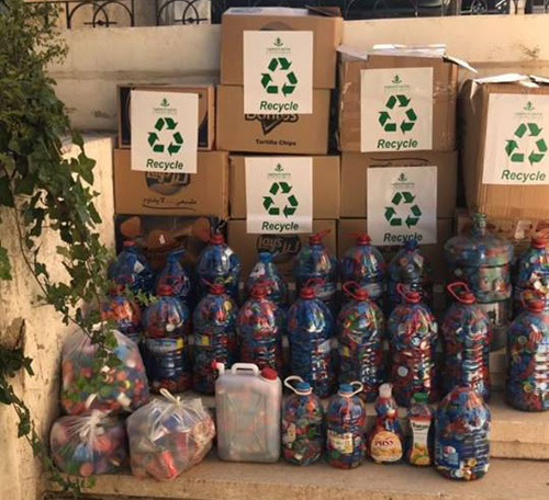 Green Wheels collects plastic caps, lids and aluminum soda cans, sells them to recycling factories and donates proceeds to support children with cerebral palsy and persons with disabilities in Jordan (Photo courtesy of Green Wheels)