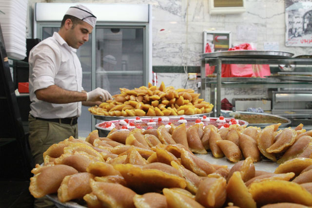 Nutritionists recommend stuffing qatayef with nuts, as they contain healthy fats and omega acids, or low-fat cheese (Photo by Hassan Tamimi)