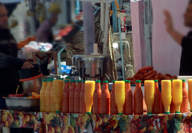 Freshly-squeezed juices are sold by vendors on sidewalks in makeshift stalls that pop up during the holy month of Ramadan (Photo by Abdullah Ayyoub)
