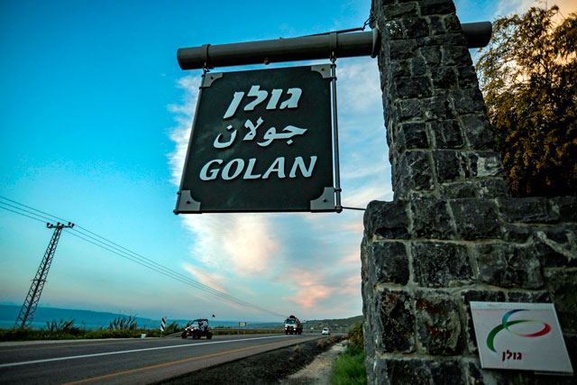 This photo taken on Sunday shows a sign reading Golan in Hebrew, Arabic and English, located at the 1967 Israel-Syria border point, near the sea of Galilee in the Israeli-annexed Golan Heights (AFP photo)
