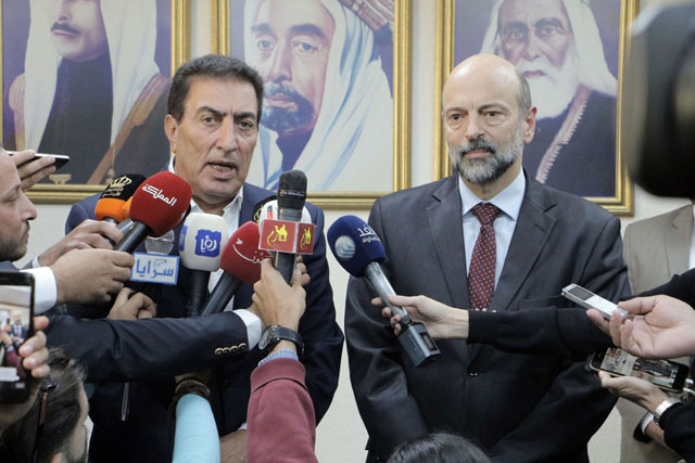 Prime Minister Omar Razzaz and Lower House Speaker Atef Tarawneh speak to the press after a meeting attended by MPs and ministers on Monday (Petra photo)