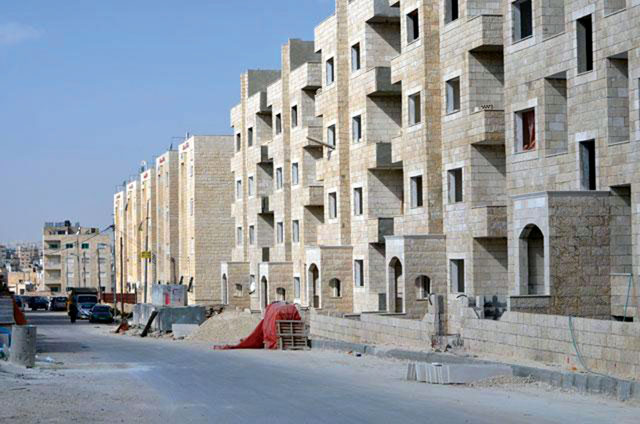 Residential apartment buildings in the final stages of construction are seen in Amman in this recent photo (JT file photo)