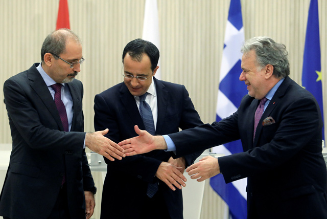 Foreign Minister Ayman Safadi meets with his Cypriot and Greek counterparts Nikos Christodoulides and Georgios Katrougalos in Cyprus on Wednesday (Reuters photo)