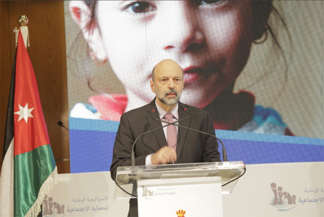 Prime Minister Omar Razzaz delivers a speech at a ceremony to launch the Social Protection and Poverty Alleviation Strategy on Wednesday (Photo courtesy of Prime Ministry)