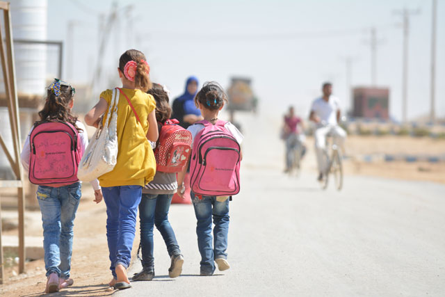 In this recent photo, Syrian refugee children are seen leaving  a school at Zaatari camp northeast of Jordan (Photo by Amjad Ghsoun)