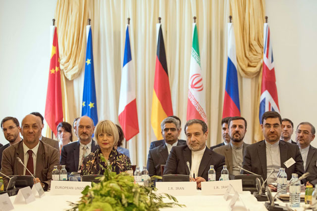 Abbas Araghchi (centre right), political deputy at the Ministry of Foreign Affairs of Iran, and Helga Schmid (centre left), secretary general of the European Union's External Action Service, take part in a meeting of the Joint Commission of the Joint Comprehensive Plan of Action attended by the E3+2 (China, France, Germany, Russia, United Kingdom) and Iran on Sunday at the Palais Coburg in Vienna, Austria (AFP photo)