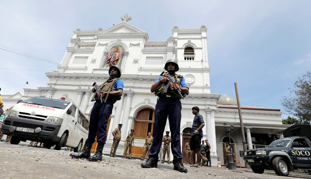   Sri Lankan military officials stand guard in front of the St Anthony's Shrine, Kochchikade Church after an explosion in Colombo, Sri Lanka, on Sunday (Reuters photo)