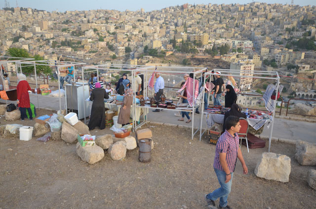 Visitors check products on display on Friday at a bazaar held at the Amman Citadel in Jabal Al Qalaa neighbourhood (Photo by Muath Freij)