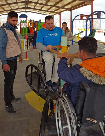 UNICEF Andorra ambassador and world-renowned rally driver, Albert Llovera, meets with children benefitting from UNICEF-supported services, in this undated photo (Photo courtesy of UNICEF)