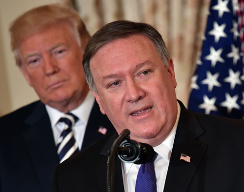 In this file photo taken on May 2, 2018, US President Donald Trump watches Mike Pompeo speak during his ceremonial swearing-in as US Secretary of State at the State Department in Washington, DC (AFP photo)