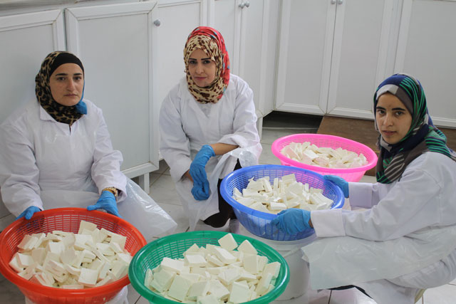 Women prepare meals at Al Aqsa Productive Kitchen recently to be distributed to schoolchildren (Photo courtesy of WFP/Lara Darwazah)