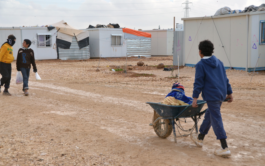 The most common job for children in the Zaatari camp is delivering goods and water using wheelbarrows, according to a study (Photo by Muath Freij)