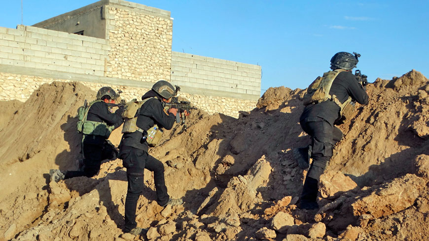 Iraqi security forces take combat position at the front line with Daesh militants as Iraqi army and allied Sunni volunteer tribal fighters supported by US-led coalition air strikes tightened the siege of Ramadi, the capital of Iraq's Anbar province, 115 kilometres west of Baghdad, Iraq, on Monday (AP)