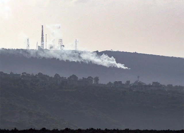 Shells fired from northern Israel fall close to the village of Jibbein near Lebanon's southern border with northern Israel on Friday (AFP photo)