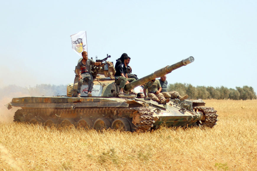 Rebel forces from Jaysh Al Islam (Army of Islam) hold a position on Monday near the frontline in Al Zahra area, on the northwestern outskirts of Aleppo, where opposition fighters have been battling Syrian pro-government forces near the Air Force Intelligence headquarters (AFP photo)