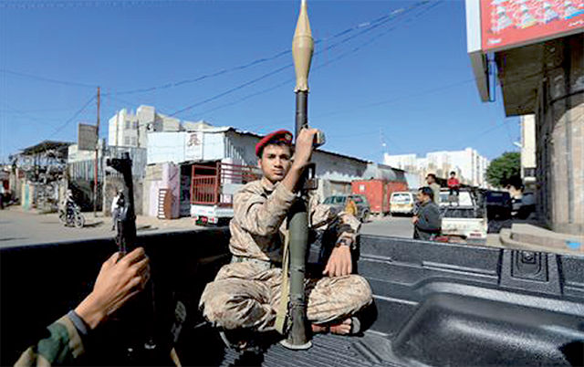 A fighter holds a rocket propelled grenade launcher as forces loyal to the Houthi rebels in Yemen participate in a military parade on the occasion of the 34th National Day to commemorate Yemeni unity, in Sanaa, on Wednesday (AFP Photo)