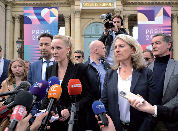 French far-right Reconquete Party former lead candidate for the European parliament election Marion Marechal (centre) makes a statement next to Reconquete's Guillaume Peltier (third left) outside the national assembly in Paris on Wednesday (AFP photo)