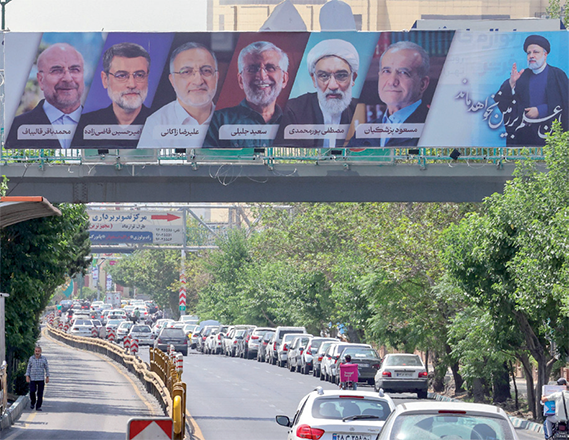 Vehicles move past a billboard displaying the faces of the six presidential candidates (left to right) Mohammad Bagher Ghalibaf, Amirhossein Ghazizadeh-Hashemi Alireza Zakani, Saeed Jalili, Mostafa Pourmohammadi and Masoud Pezeshkianin in the Iranian capital Tehran on Saturday (AFP photo)